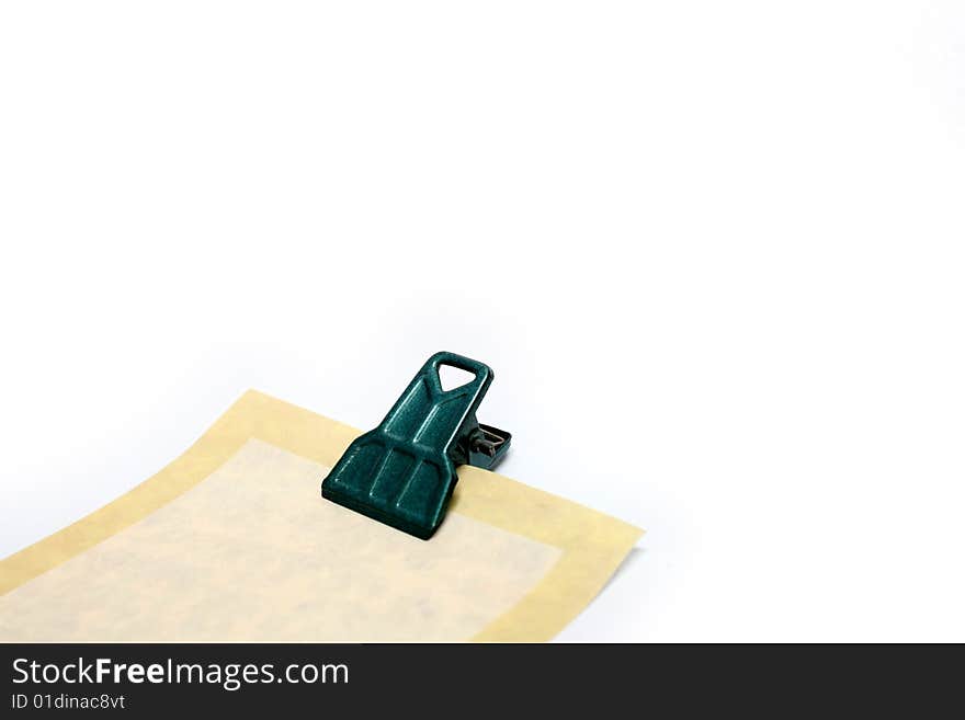 Paper note with clip on white background