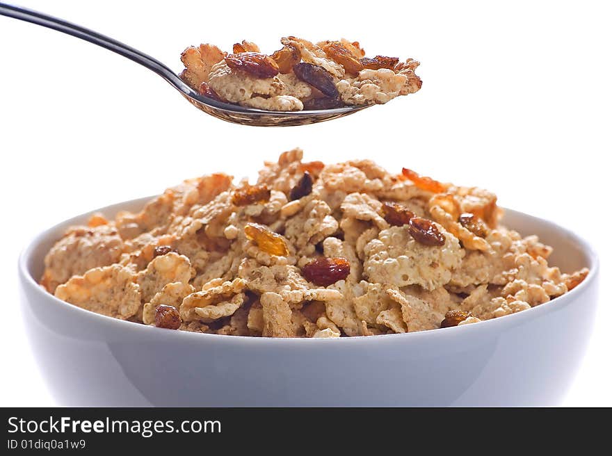 Bowl of cereal with raisins and milk