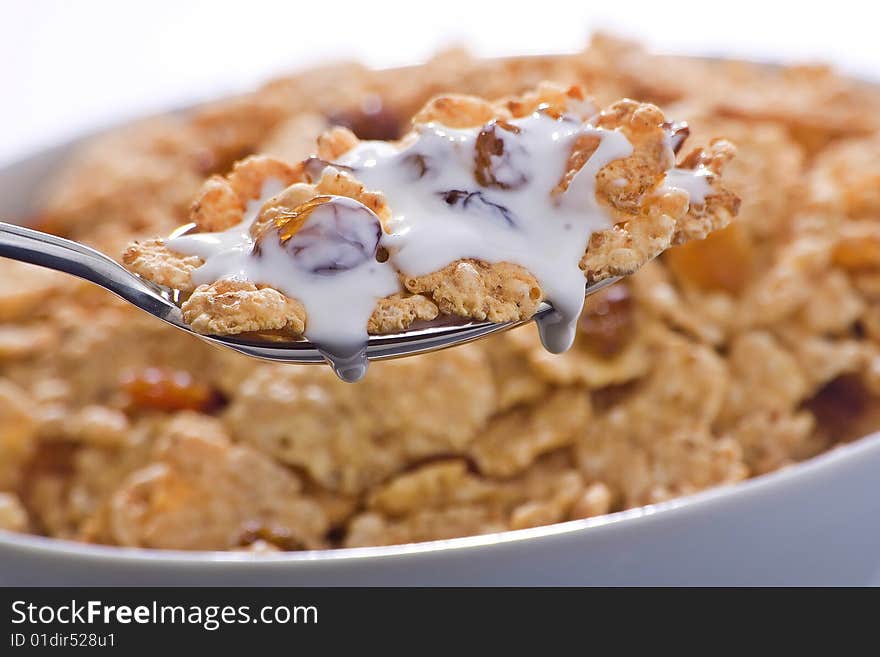 Bowl of cereal with raisins and milk