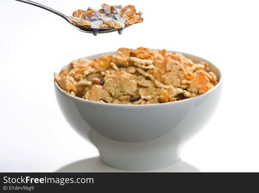 Bowl of cereal with raisins and milk