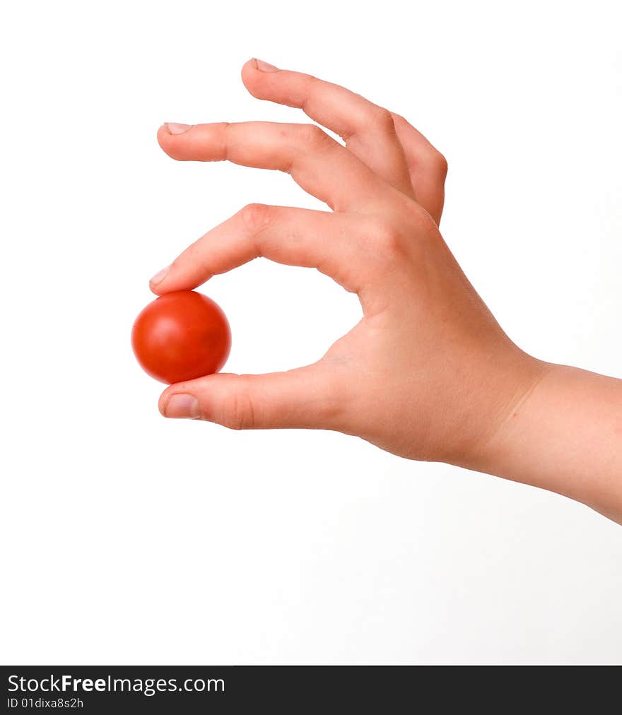 Hand with cherry tomato isolated on white background