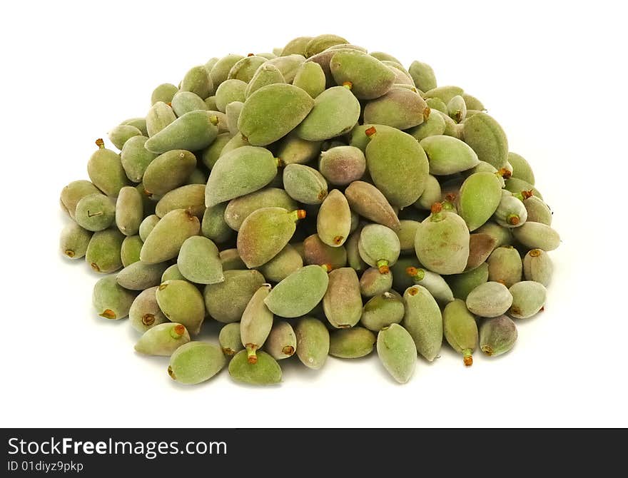 Green almonds isolated at white