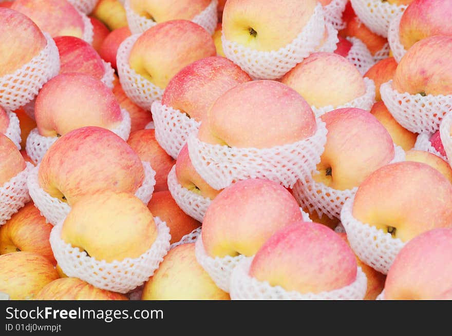 The red ripe and luscious apples pile up in the box. The red ripe and luscious apples pile up in the box.