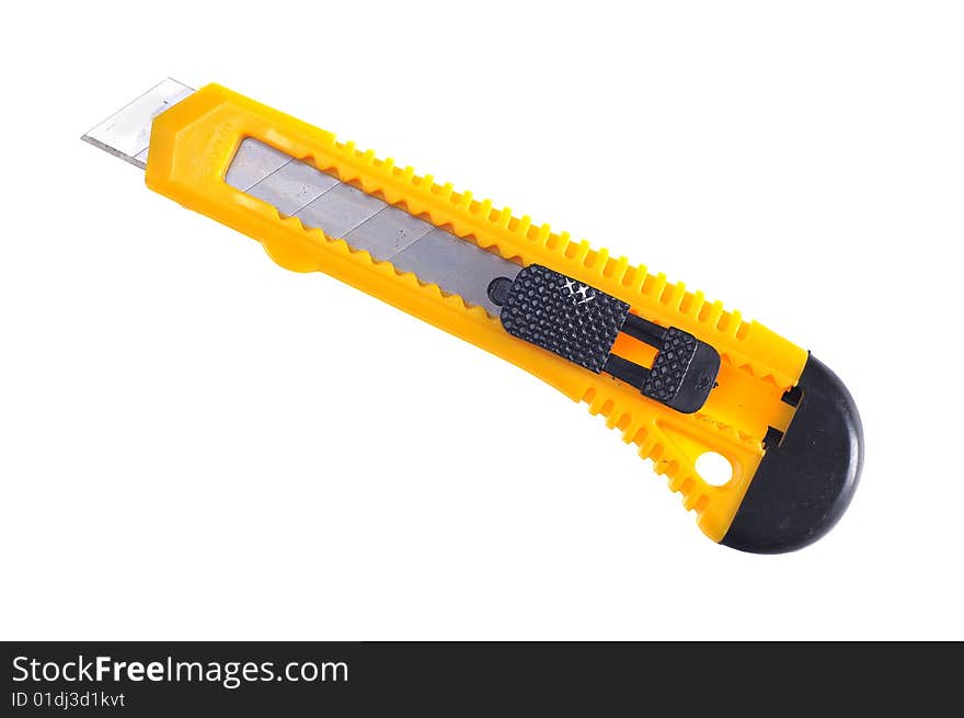 Sharp retractable utility knife with yellow plastic handle. Isolated on the white background. Sharp retractable utility knife with yellow plastic handle. Isolated on the white background.