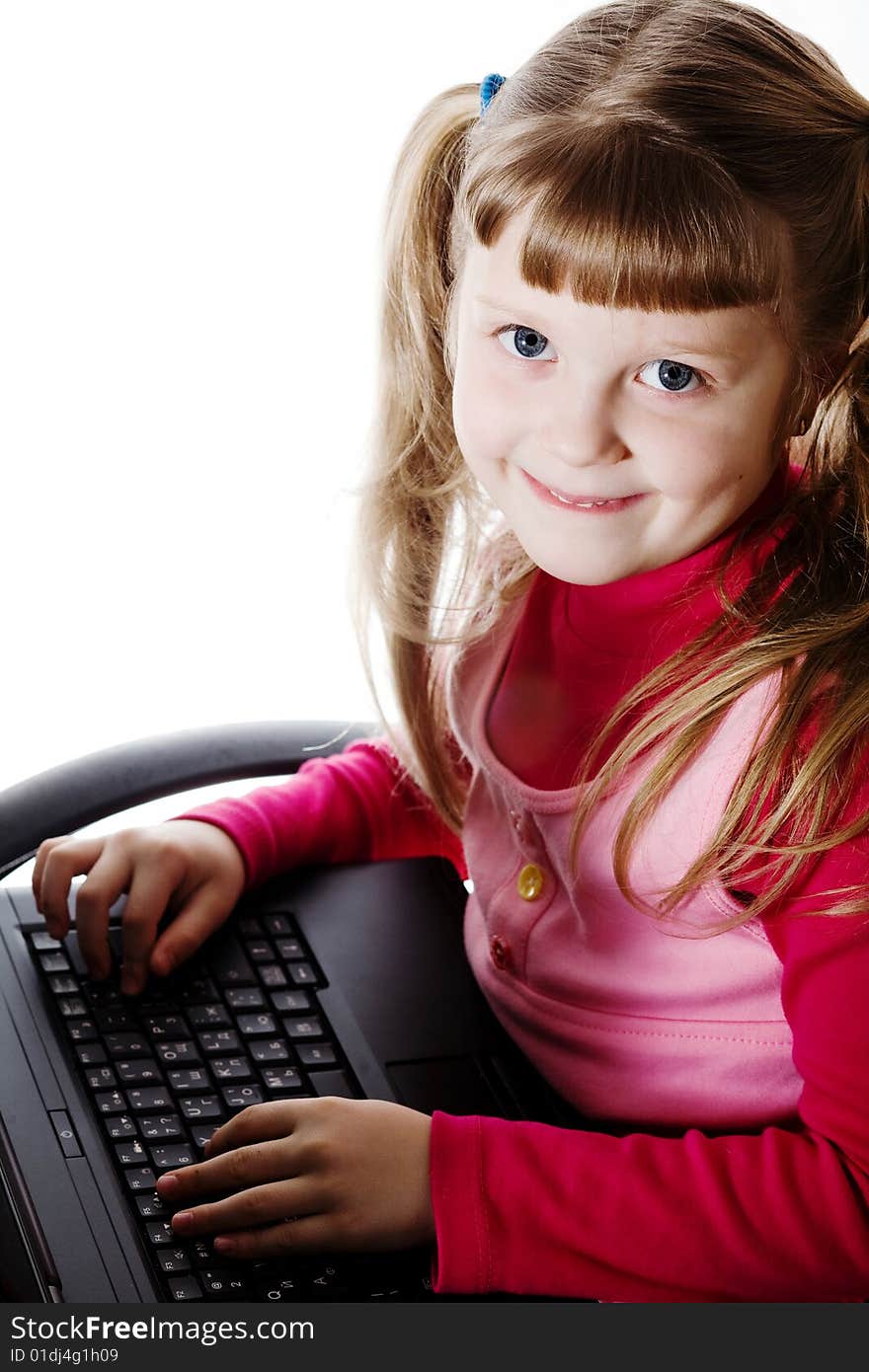 Stock photo: an image of a girl with a black laptop. Stock photo: an image of a girl with a black laptop