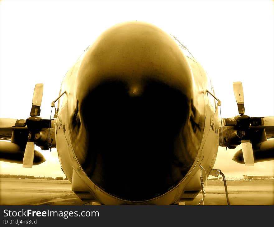 C 130 airplane Belgian army on tarmac, (front view) in sepia color. C 130 airplane Belgian army on tarmac, (front view) in sepia color.