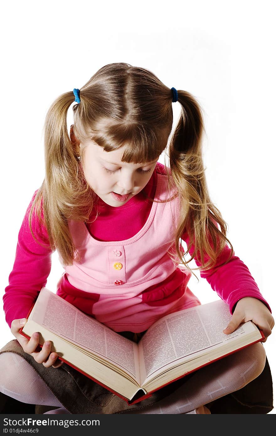 Stock photo: an image of a girl with a big book. Stock photo: an image of a girl with a big book