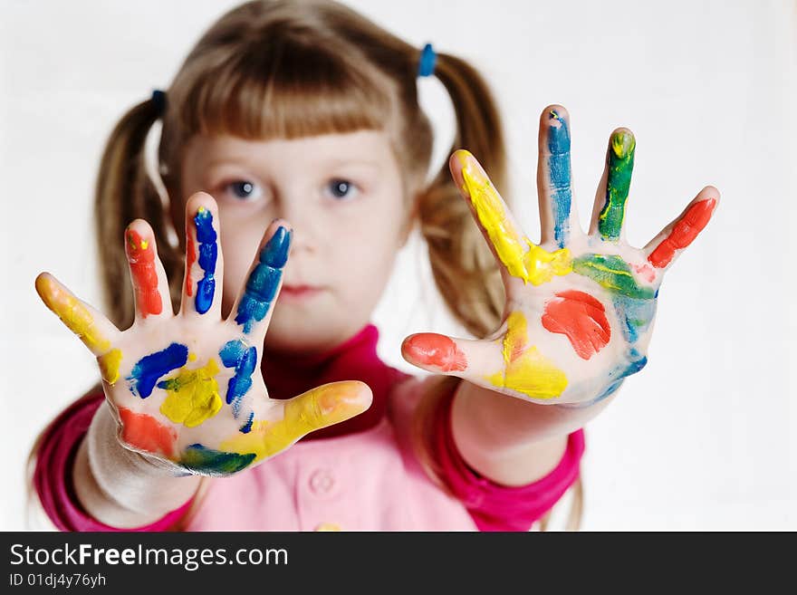 Stock photo: an image of a little girl with her hands in paint. Stock photo: an image of a little girl with her hands in paint