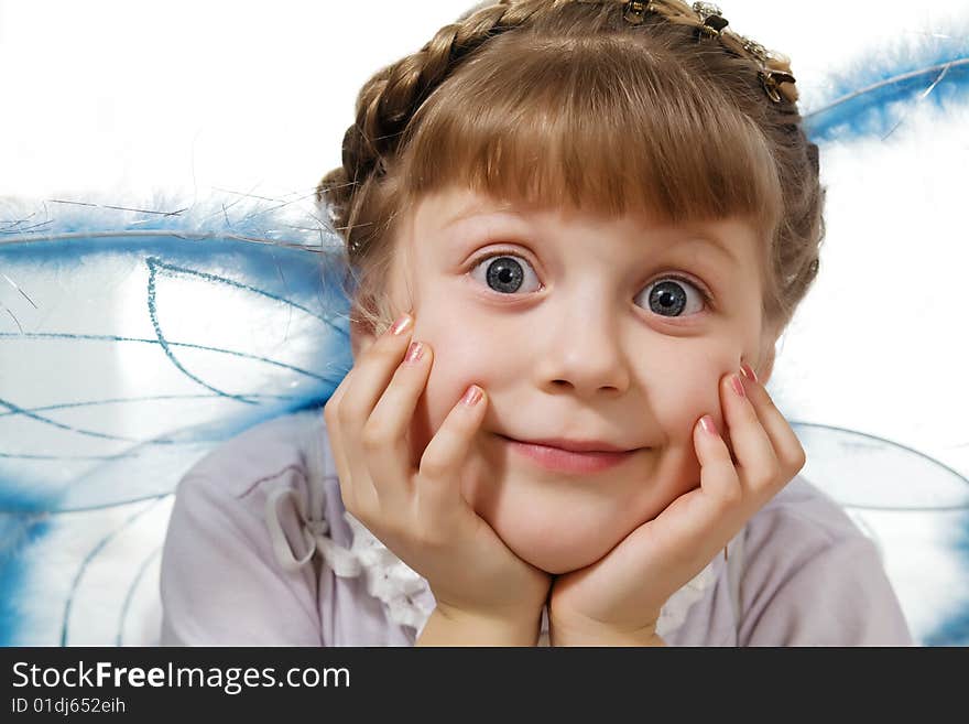 Stock photo: an image of a little girl with wings