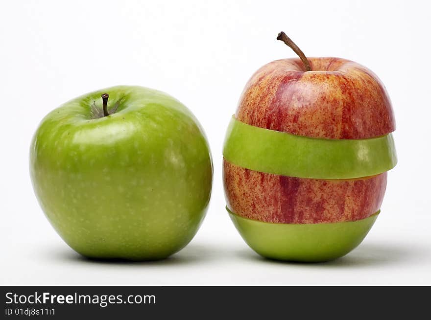 Red and green sliced apples isolated on white