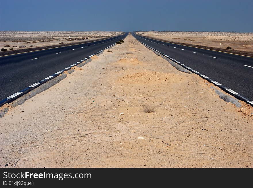 Road thru the desert near Dubai city. Road thru the desert near Dubai city.