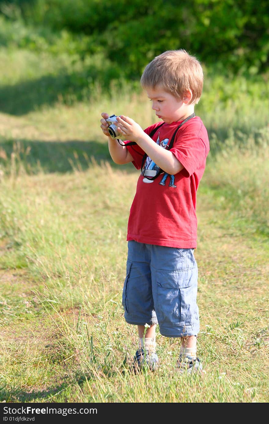 Young boy, photographer, digital camera, one person. Young boy, photographer, digital camera, one person