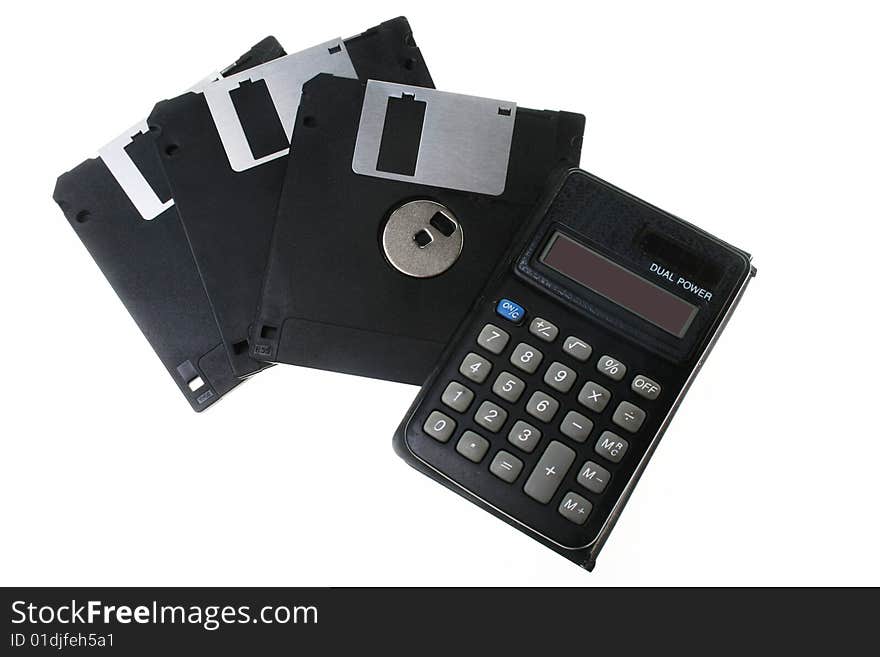 Diskettes and the calculator, isolated on a white background. Diskettes and the calculator, isolated on a white background