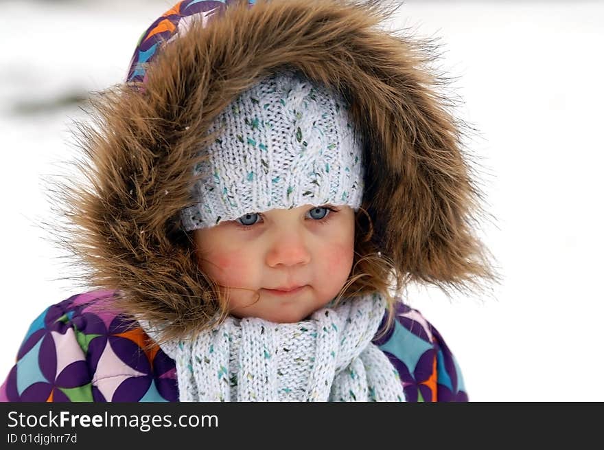 Winter portrait of smiling small girl. Winter portrait of smiling small girl