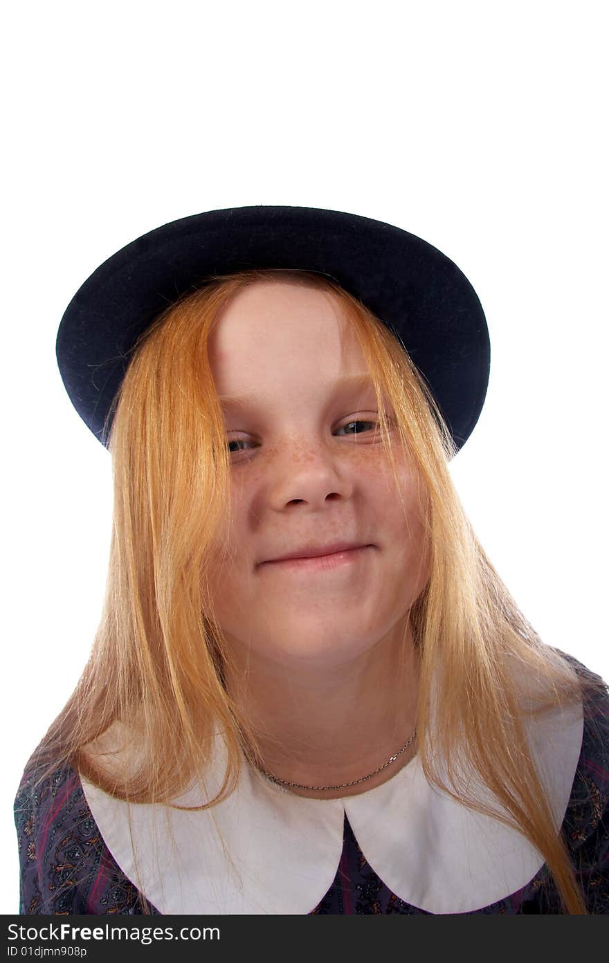 Portrait of the smiling redhead girl in the retro hat