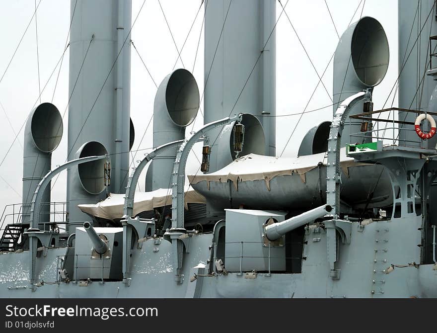 Cruiser Aurora (the symbol of the Great October Socialist Revolution of 1917) on the river Neva in Saint Petersburg. Cruiser Aurora (the symbol of the Great October Socialist Revolution of 1917) on the river Neva in Saint Petersburg