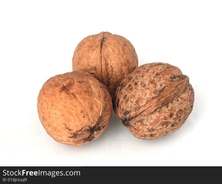 Photo of three nuts on white