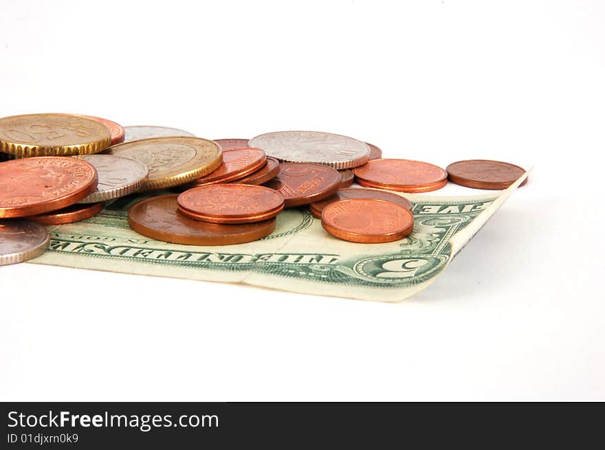 Five dollar paper money with worldwide coins isolated on the white background. Five dollar paper money with worldwide coins isolated on the white background.