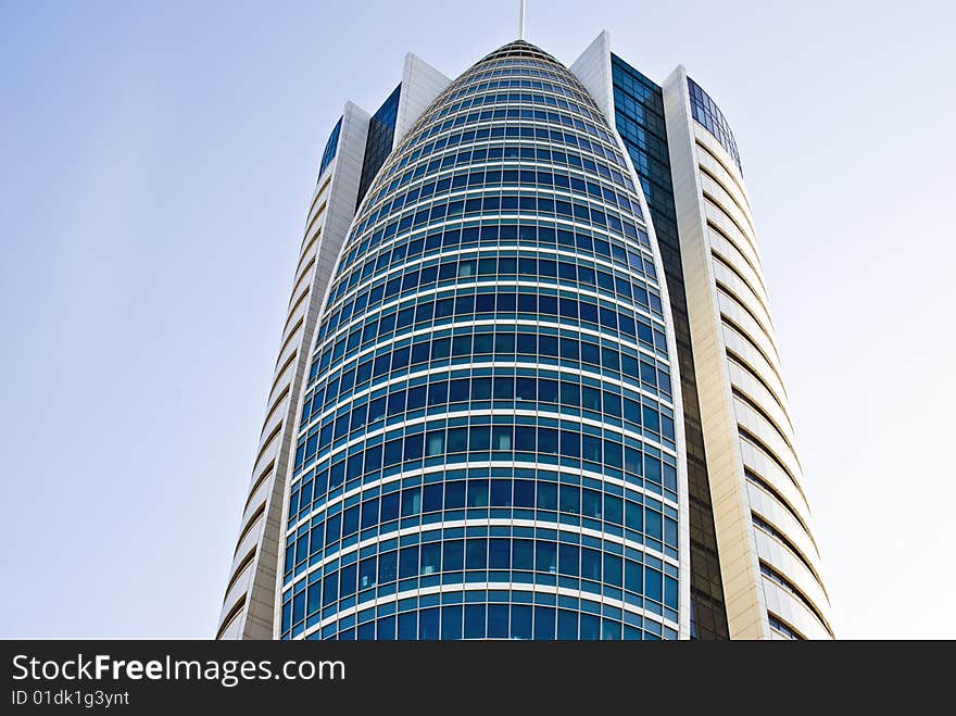 Looking upward on a high modern office building. Looking upward on a high modern office building