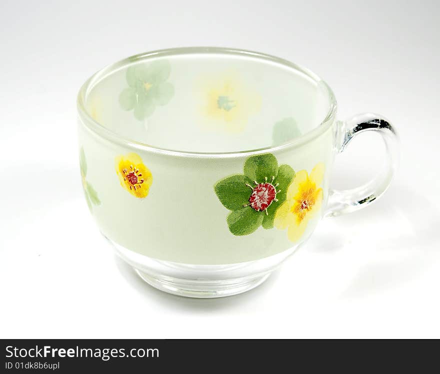 Tea transparent cup  with an ornament from green c