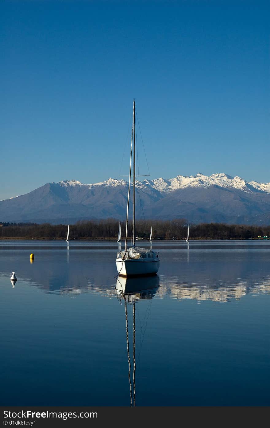 Sailboat at the lake with mountain