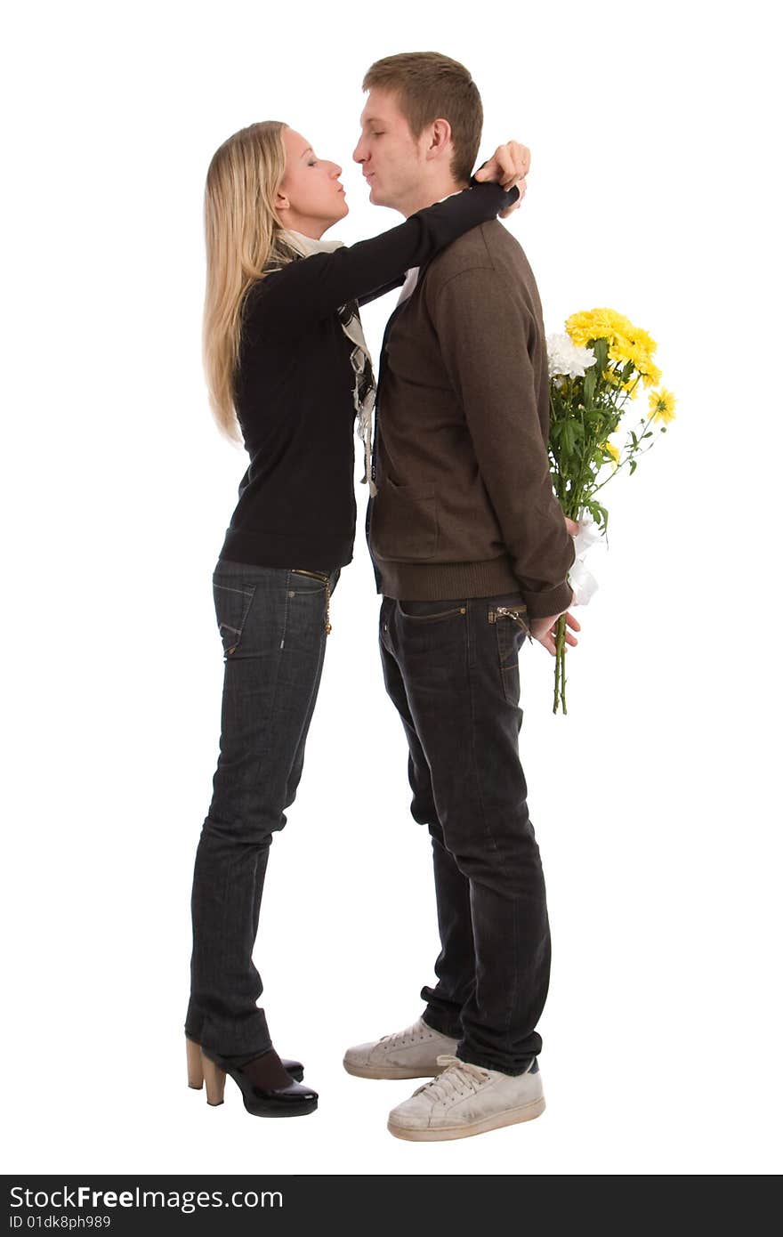 Appointment. The enamoured guy and the girl with a bouquet of yellow flowers. Appointment. The enamoured guy and the girl with a bouquet of yellow flowers.