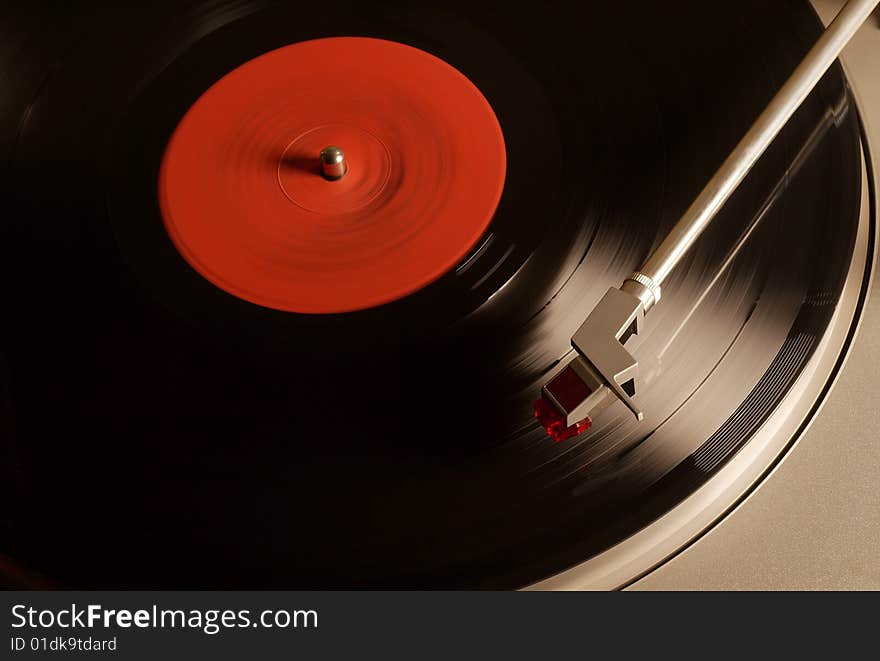 Photo of Vintage vinyl record with red label. Photo of Vintage vinyl record with red label