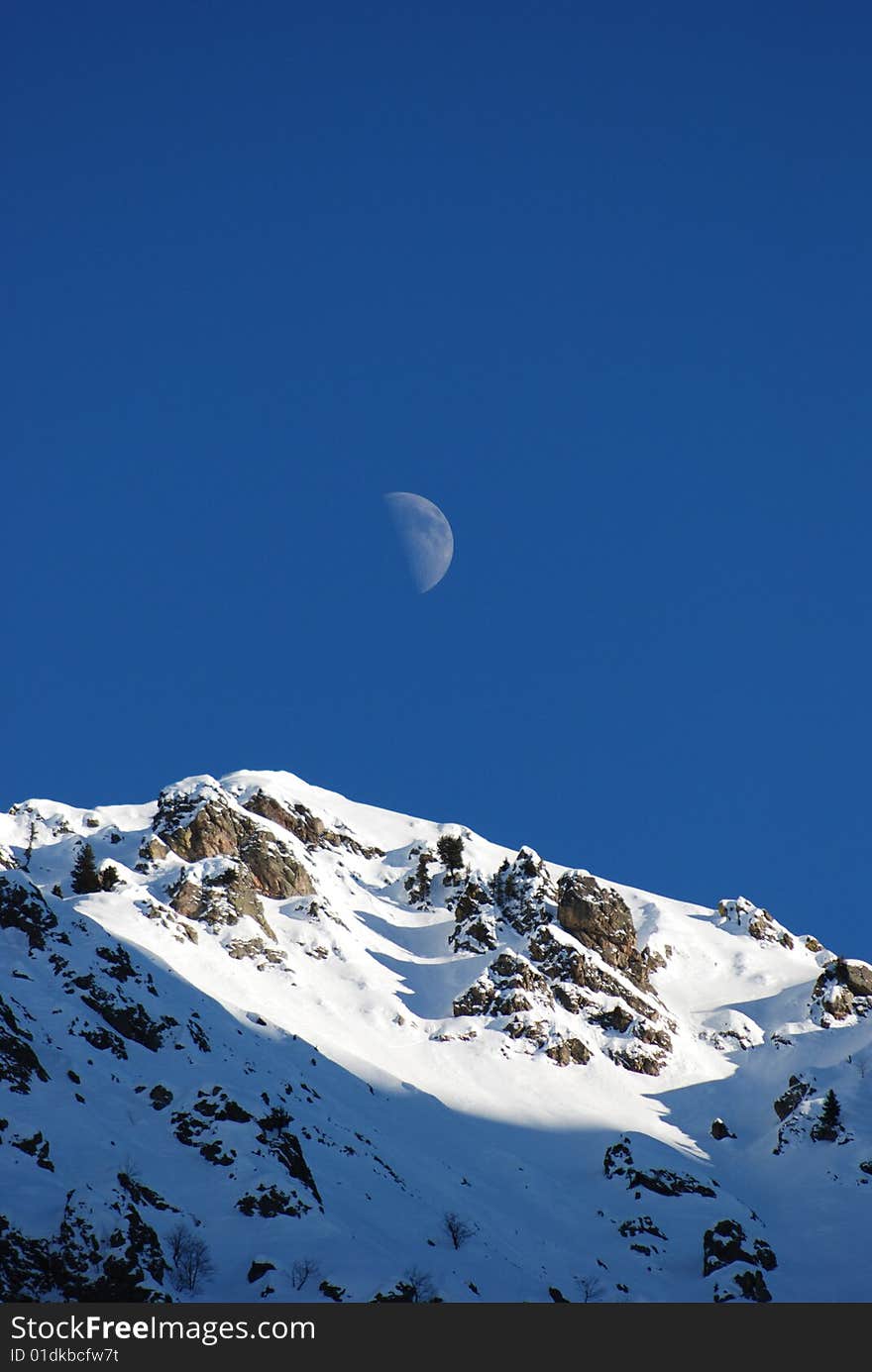 Top of mountain with daily moon. Top of mountain with daily moon