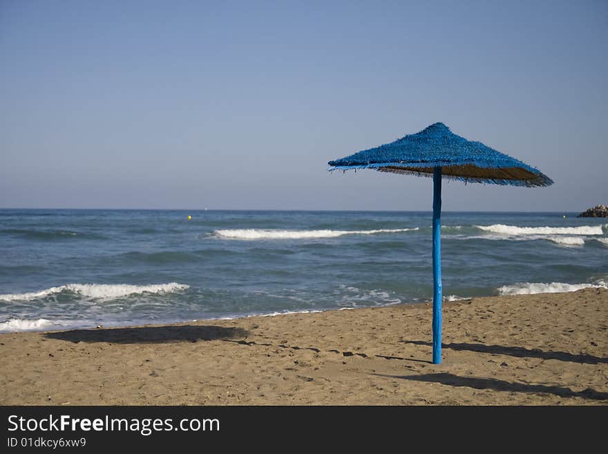 Beach blue umbrella and horizon. Beach blue umbrella and horizon