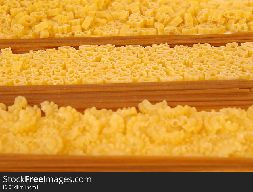 Raw macaroni collection as close-up food background. Raw macaroni collection as close-up food background