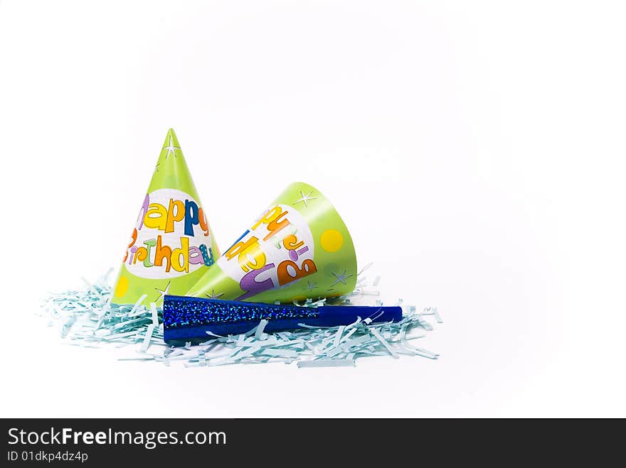 Party hats and paper horns on a white background