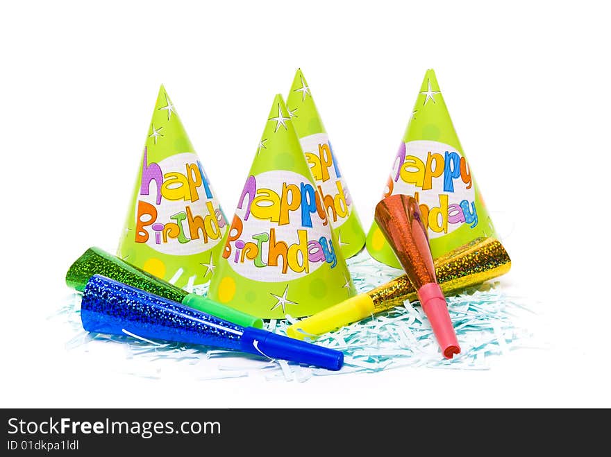 Party hats and paper horns on a white background