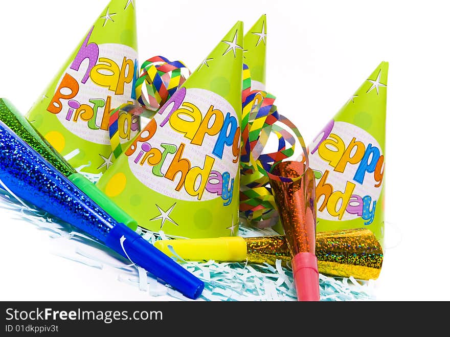 Party hats and paper horns on a white background