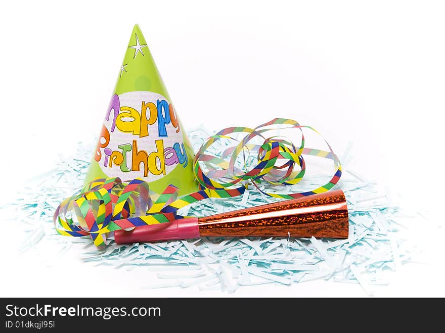 Party hats and paper horns on a white background