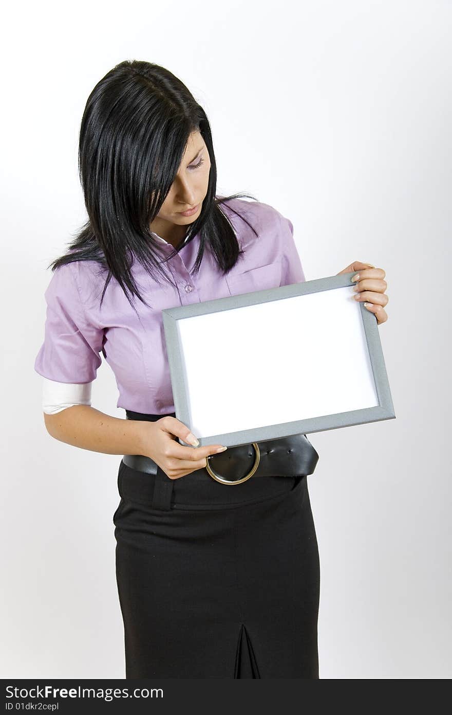 Attractive businesswoman holding a frame. Attractive businesswoman holding a frame