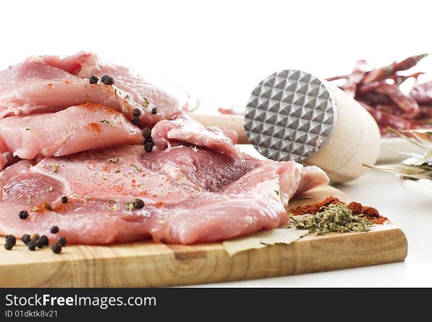 Raw meat on wooden board