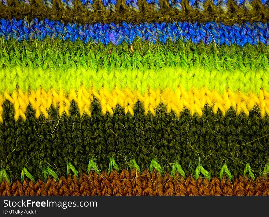 Woolen texture from the threads of many colors.