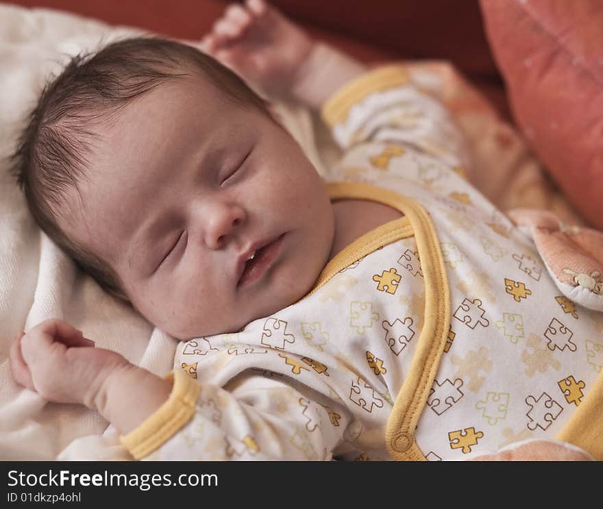 Newborn baby lying on its back and sleeping. Newborn baby lying on its back and sleeping.