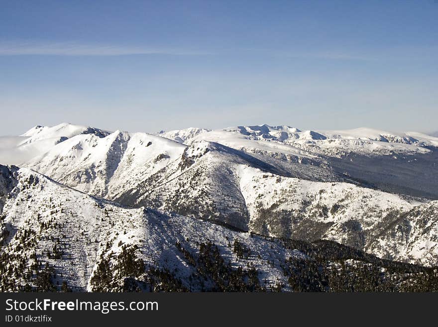 A snow - white mountain range over 3400 m. A snow - white mountain range over 3400 m.