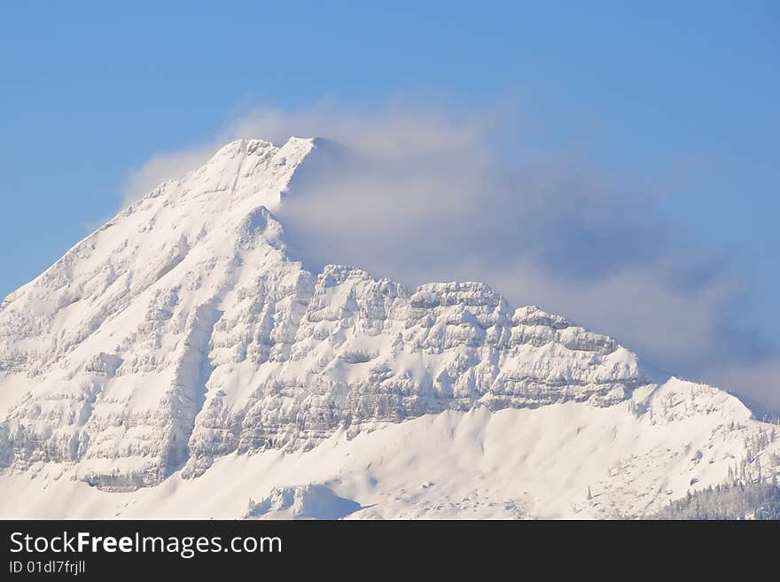 Mountain peak of the Alps in clouds. Mountain peak of the Alps in clouds