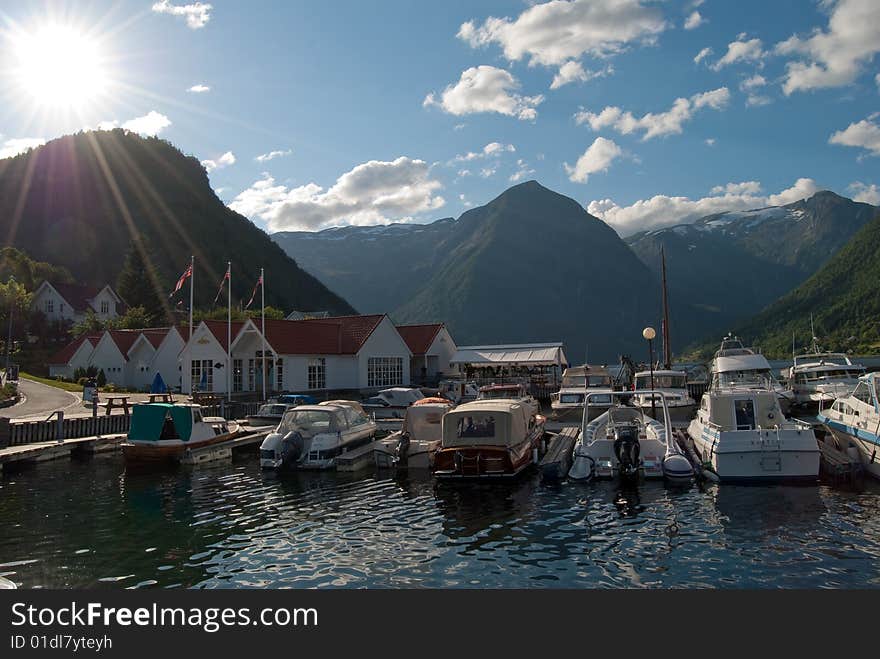 Idyllic marina in Balestrand, situated at the Northern coast of Sognefjord in Western Norway. Idyllic marina in Balestrand, situated at the Northern coast of Sognefjord in Western Norway.