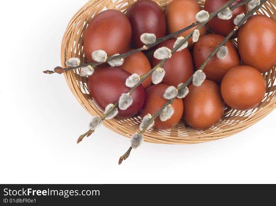 Easter eggs in a basket in a white background