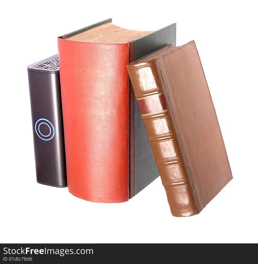 Old leather bound books with a computer hard drive isolated on a white background