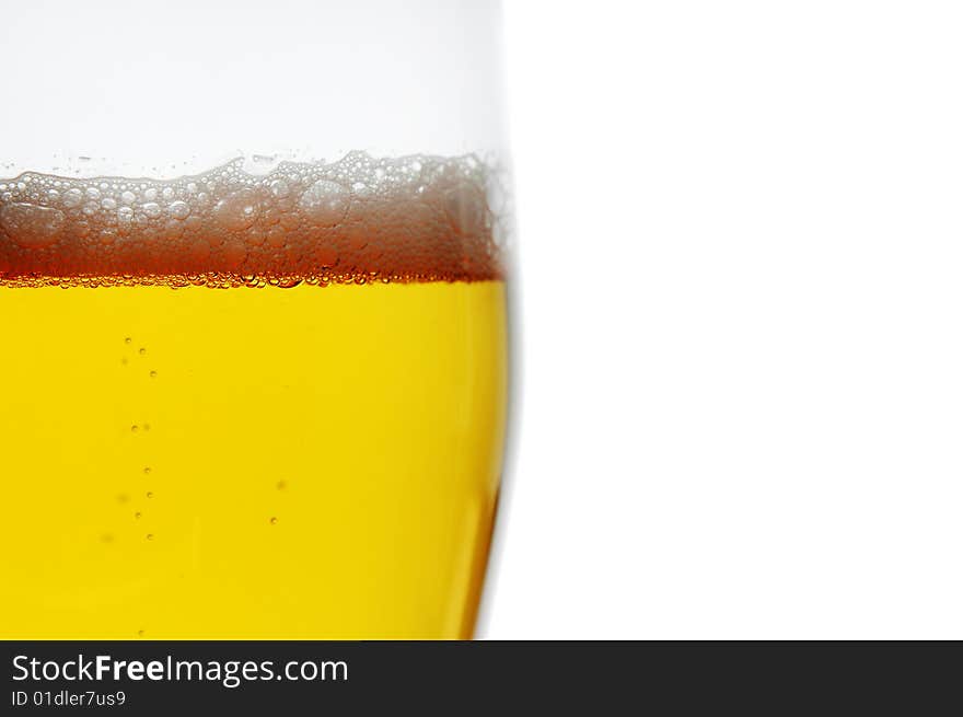 Pint of beer closeup isolated on white with space for text