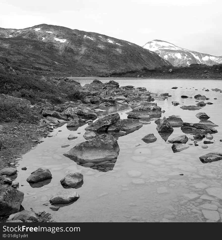 Black-and-white picture of a lake in the Strynefjell mountains in Norway. Black-and-white picture of a lake in the Strynefjell mountains in Norway.