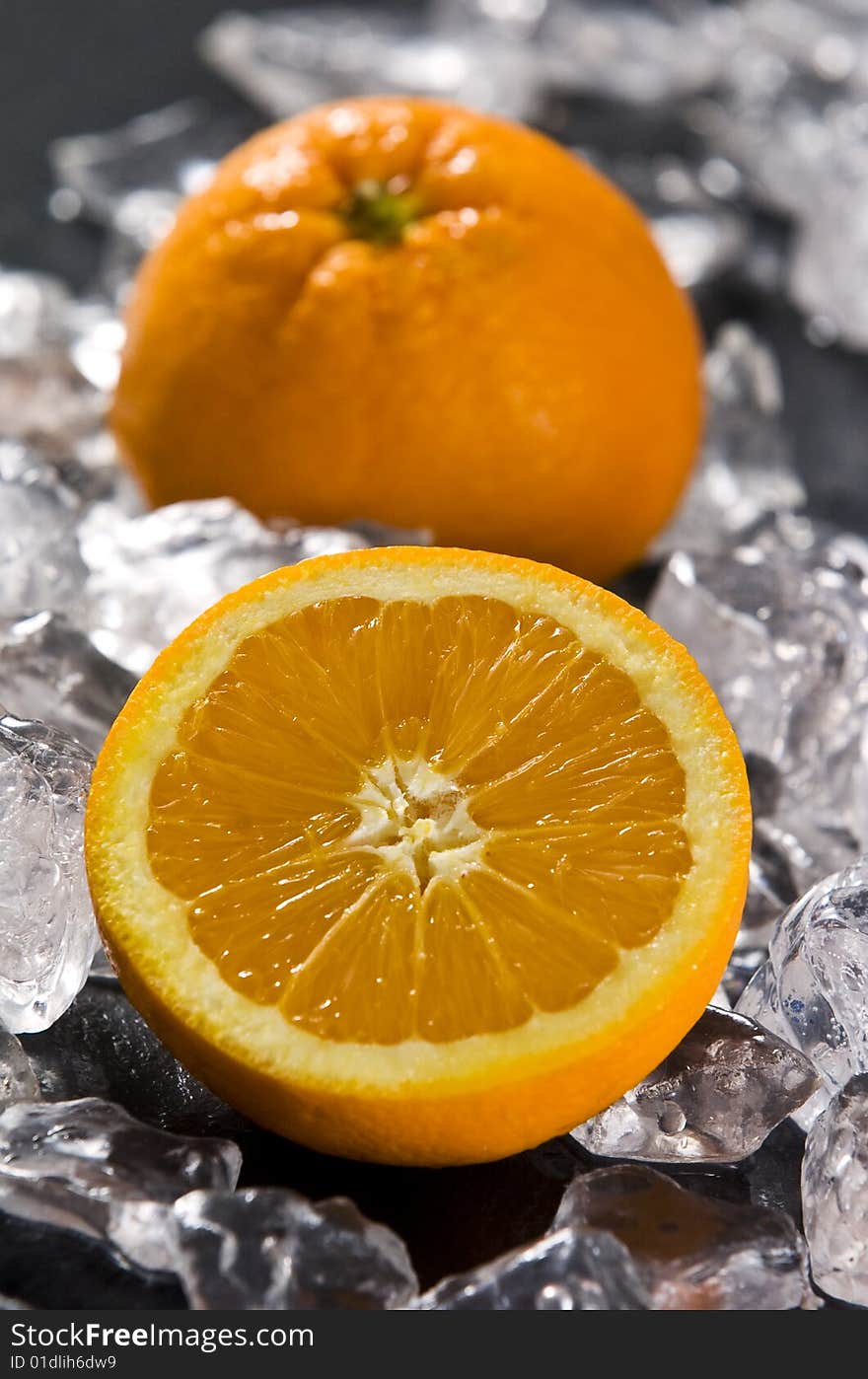 Orange on black slate with ice