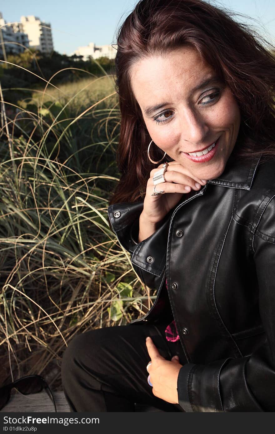 Woman smiling and looking over her shoulder. Woman smiling and looking over her shoulder