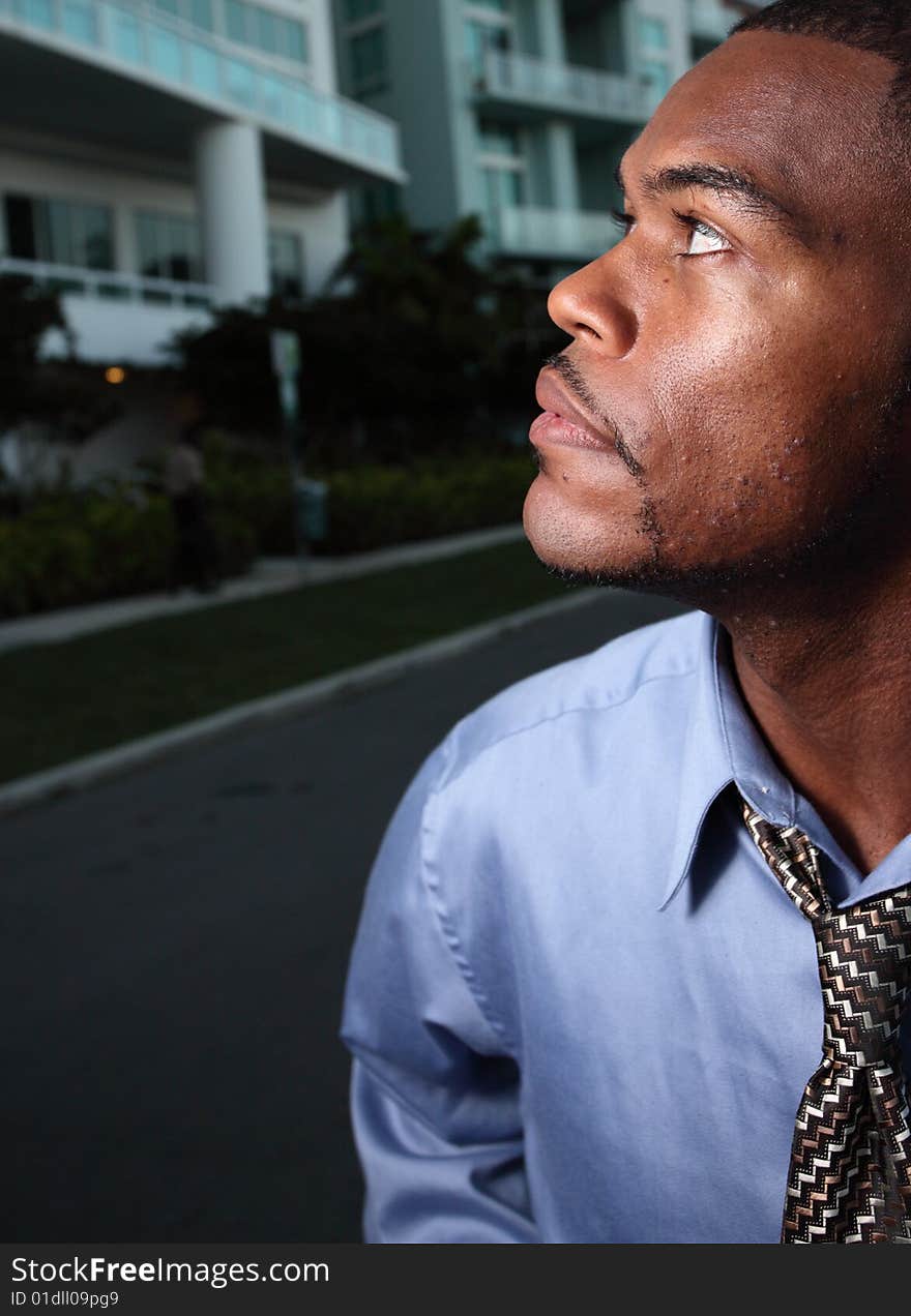 Profile headshot of a man looking away