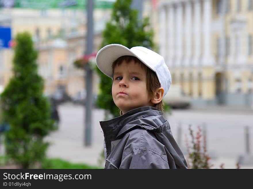 The offended grimace on the face of person of the four-year boy. The offended grimace on the face of person of the four-year boy