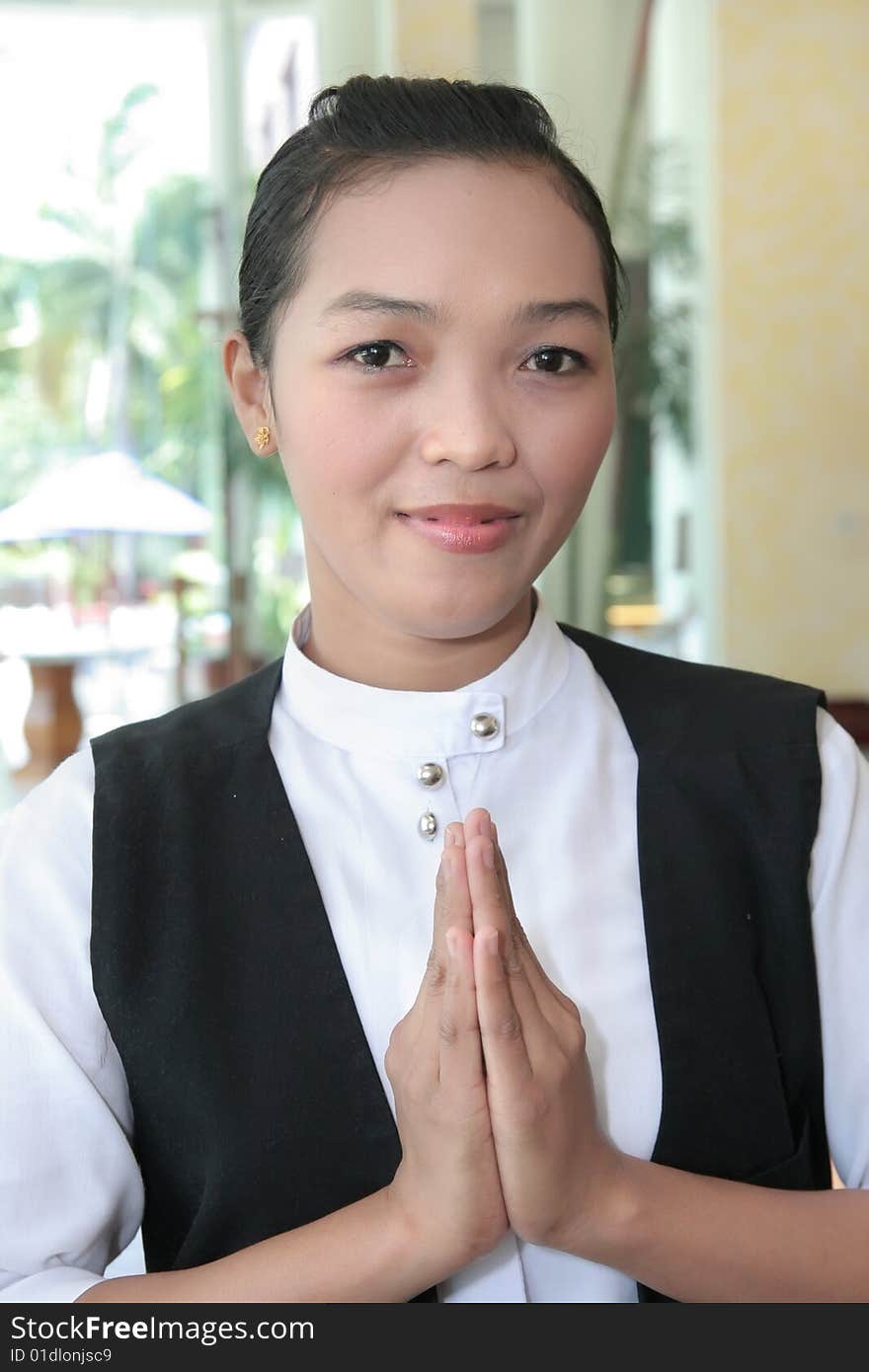 Asian waitress at work greeting